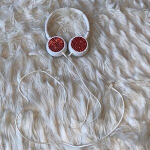 White wired headphones w/ red rhinestones. Only used 4 travel POM competitions